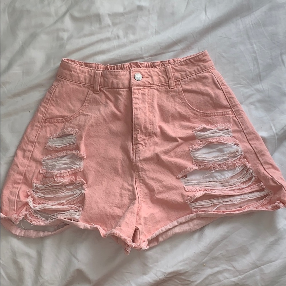 Pink distressed jean shorts